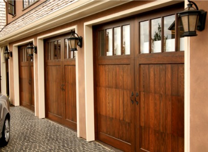 How Much Does a Garage Door Cost? Wood garage doors can be more expensive than other material types